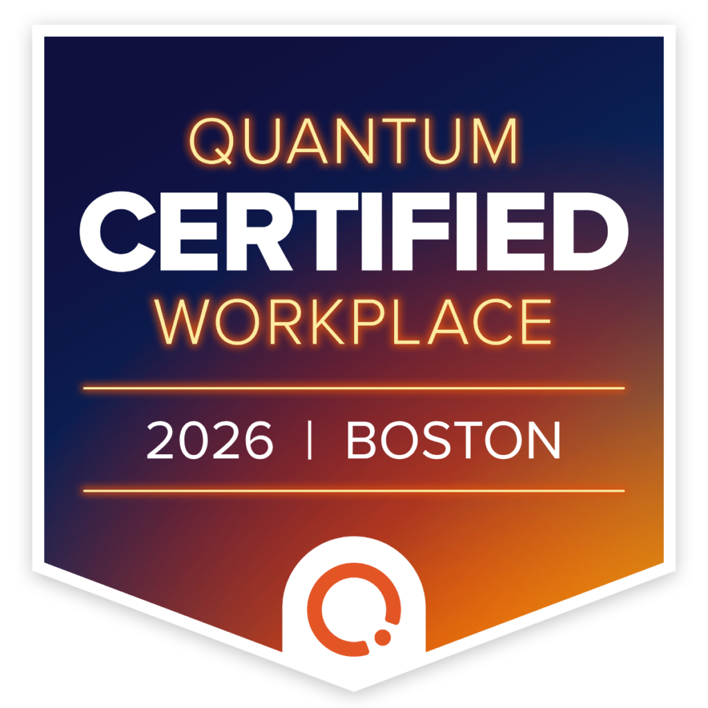Shield-shaped badge with text: Quantum Certified Workplace, 2026 | Boston, on a blue and orange gradient background.